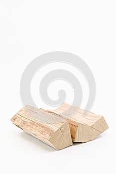 image with firewood logs isolated on a white table surface