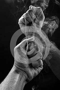 Image of a  fist   and smoke