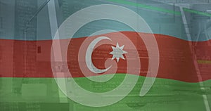 Image of flag of azerbaijan over computer interface against laptop on desk in office