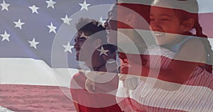 Image of flag of united states of america over biracial couple carrying children piggyback