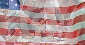 Image of flag of united states of america waving over smiling caucasian family