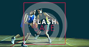 Image of flash sale text over diverse basketball players on black background