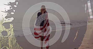 Image of frame over caucasian woman with usa flag dancing on beach