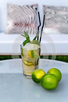 A freshly made mojito cocktail on a table