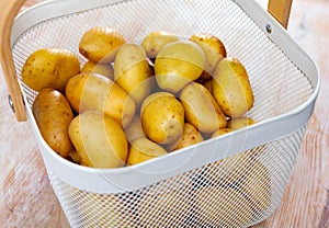 Image of freshly washed potatoes in a bucket