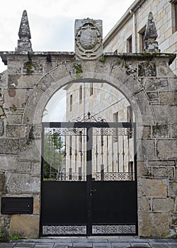 Gate with an arch in a stone wall