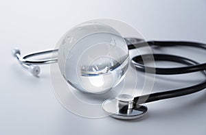Image of a glass globe and stethoscope