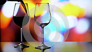 Image of glasses, bottles and alcohol on a luminous background.