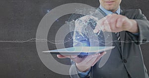 Image of globe and data processing over businessman holding tablet