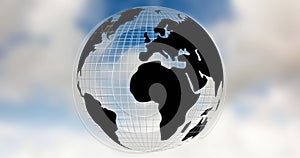 Image of globe spinning over clouds