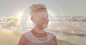 Image of glowing light over portrait of happy senior woman