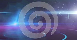 Image of glowing spots of light shimmering on blue to purple background