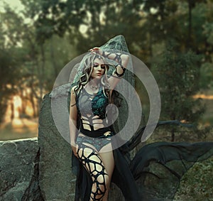 Image of Gorgon Medusa, braid hair and gold snakes, close-up portrait. Gothic make-up in green shades. Background of