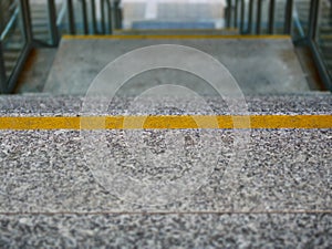 Image of granite stairs with yellow line markers