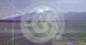 Image of graphs, globe and data processing over wind turbine