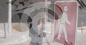 Image of graphs and statistics over a man crossing the street photo