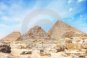 Image of great pyramid of Giza. Cairo, Egypt. In the foreground is a and small pyramids of priests