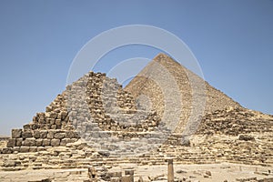 Image of great pyramid of Giza. Cairo, Egypt. In the foreground is a and small pyramids of priests. pyramids of the queens of giza