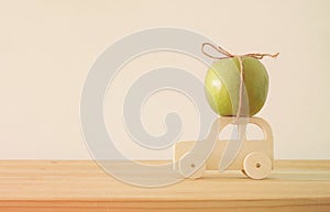 image of green fresh apple over wooden car. Rosh hashanah & x28;jewish New Year holiday& x29; concept. Apple - Traditional symbol.