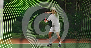 Image of green line spiral rotating over male tennis player hitting ball during match
