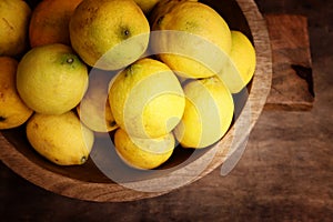 Image of group of fresh lemons over old vintage wooden table