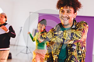 Image of group of group of diverse female and male hip hop dancers taking part in photo shot