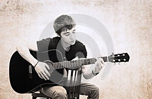 Image in grunge style,man and guitar