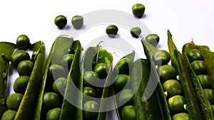 image of half pealed green pea isolated on white background