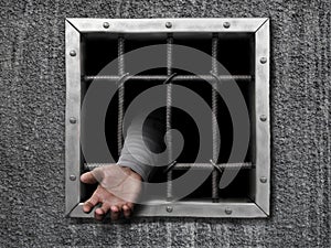 Hand of prisoner in jail