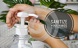 Image of  hand sanitizer usage with wordings `sanitize your hands`