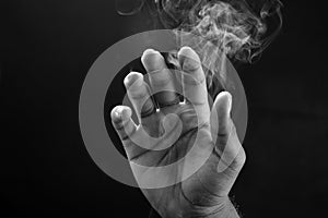 Image of a hand  and smoke