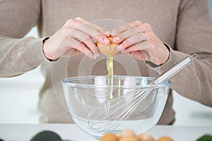 image hands breaking egg