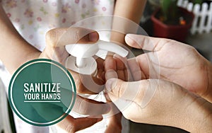 Image of hands and hand sanitizer dispenser