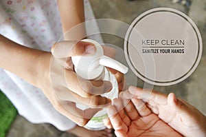 Image of hands and hand sanitizer dispenser