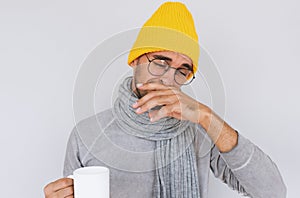 Image of handsome male caught cold when had walk outdoors in winter or autumn. Portrait of sick man have grippe wearing glasses, photo