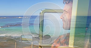 Image of happy african american couple having fun on beach over seascape