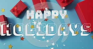 Image of happy holidays christmas text over presents on blue background