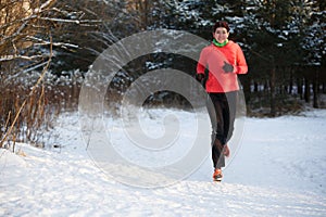 Image of happy sports girl on morning run in winter park