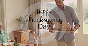 Image of happy thanksgiving day text over caucasian man holding turkey