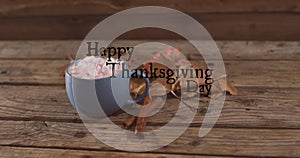 Image of happy thanksgiving day text over cocoa