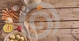Image of happy thanksgiving day text over vegetables