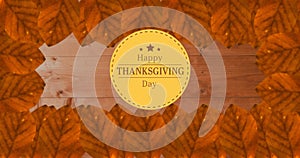 Image of happy thanksgiving day text over wooden background with autumn leaves