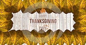 Image of happy thanksgiving day text over wooden background with autumn leaves