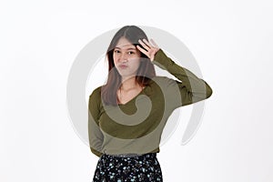 Image of happy young girl standing and Looking camera pointing isolated over white background.