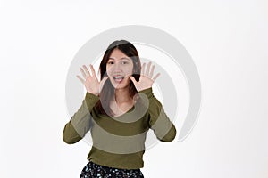 Image of happy young girl standing and Looking camera pointing isolated over white background.