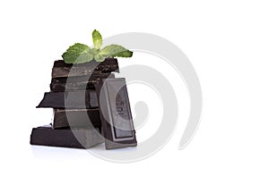 Black chocolate and mint leaves isolated on white background. photo