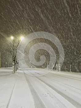 Image of heavy snowfall. Diluted road in the city. Snowstorm in the city