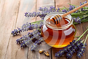 Image Honey jar with dipper stick and lavender flowers, beekeeping concept