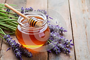 Image Honey jar with dipper stick and lavender flowers, beekeeping concept