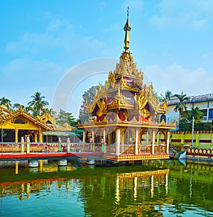 The Image house on pond, Kyay Thone Pagoda, Yangon, Myanmar photo